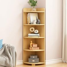 a corner shelf with books and other items on it in the corner of a room