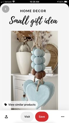 a blue heart hanging from a rope with the words home decor small gift idea