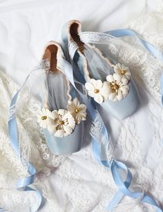 A pair of beautiful, pastel-colored, shabby chic pointe shoes hand-dyed in light blue and decorated with white and golden flowers. Double satin and lace ribbons attached to add a special accent to these charming , vintage looking ballet shoes. Tulle inserts included. These pointe shoes were danced, loved and now have been given a new life, and hopefully will find a new home soon! They could be a lovely gift to any ballet lover or a beautiful piece of decor. Original brand: Bloch. Total length of Blue Pointe Shoes, Decorated Pointe Shoes Ideas, Fancy Pointe Shoes, Blue Ballet Shoes, Decorative Pointe Shoes, Mermaid Pointe Shoe, Point Shoes, Pointe Shoes, Lace Ribbon