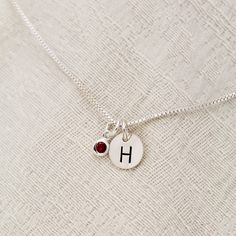 "January Birthstone Initial Necklace, Garnet Jewelry, January Birthday Gift, January Birthstone Jewelry,Personalized, Sterling Silver Garnet Lovely January Birthstone Garnet Necklace. For babies born in January, the garnet is the perfect gem to represent their birthstone. This beautiful stone, which is most commonly red but can be found in a range of other colors, symbolizes peace, prosperity and good health. Some say it even has the power to give the wearer eternal happiness, health and wealth. Valentine's Day Birthday Birthstone Necklace, Birthstone Necklace For Birthday And Valentine's Day, Birthstone Necklace For Birthday Gift, Round Birthstone Necklace With Charms For Birthday, Charm Birthstone Necklace For Birthday Gift, Round Charms Birthstone Necklace Birthday Gift, Round Charm Birthstone Necklace For Birthday Gifts, Birthday Round Gemstone Charm Necklace, Birthday Birthstone Charm Necklaces With Round Pendant