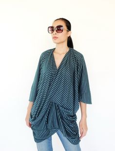 "🚚..ALL ORDERS ARE SHIPPED VIA DHL EXPRESS MAIL Refine your casual look with the luxurious of a beautifully feminine look. * Pull-on style * V neckline * Dropped shoulder; short sleeves * Drape front * An asymmetrical hem * Allover stripes pattern Measurements approximately: Shoulder: 40\" (101.5 cm)-shoulder to shoulder Bust: 64\" (162 cm) Sleeve length: 4\" (10 cm) Sleeve cuff: 14\" (35.5 cm)-round Hips: 44\" (112 cm) Top length from shoulder to hem: 25\" (63.5 cm) at centre front and 31\" (7 Drapey Asymmetrical Summer Tops, Versatile Draped Summer Top, Asymmetrical Viscose Top For Summer, Summer Asymmetrical Viscose Top, Versatile Draped Tops For Spring, Chic Green Wrap Top, Chic Viscose Tops With Asymmetrical Hem, Chic Viscose Top With Asymmetrical Hem, Chic Asymmetrical Drapey Tops