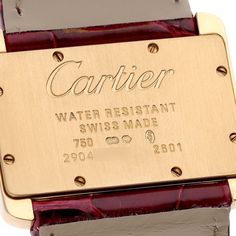 Cartier Tank Divan Mini Yellow Gold Red Strap Ladies Watch W6300356. Quartz movement. 18K yellow gold case 31.5 x 25.0 mm. Circular grained crown set with the blue faceted sapphire. 18K yellow gold fixed smooth bezel. Scratch resistant sapphire crystal. Silver dial. Painted black Roman numeral hour markers. Sword-shaped blue hands. Secret Cartier signature at X. Red leather strap with 18K yellow gold tang buckle. Vintage Cartier Gold Watch Accessories, Vintage Gold Cartier Watch Accessories, Modern Gold Cartier Watches, Cartier Polished Finish Gold Watch Accessories, Rectangular Yellow Gold Watch Accessory For Anniversary, Designer Yellow Gold Watch Accessories With Polished Finish, Vintage Cartier Rectangular Watch, Luxury Gold Cartier Watch Accessories, Gold Rectangular Cartier Watch