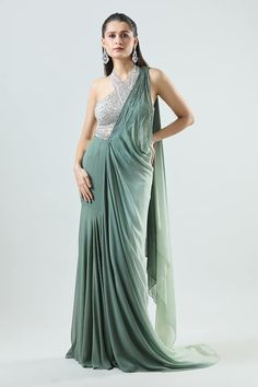 Green pre-draped saree in a mermaid silhouette. Comes with green-white ombre drape featuring embellished waistband. Paired with sequin bead embellished padded halter neck blouse. - Aza Fashions Mermaid Saree, Halter Neck Blouse, Saree Gowns, Dhoti Saree, Cotton Sarees Handloom, Halter Neck Blouses, Draped Saree, Ruffle Saree, Sequin Halter