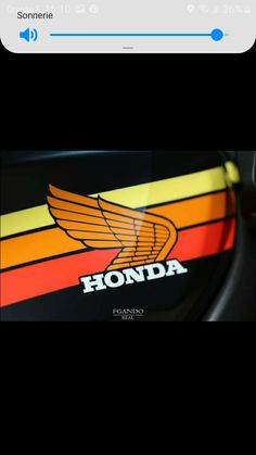 the honda logo is shown on this motorcycle's side view mirror, and it appears to be in color