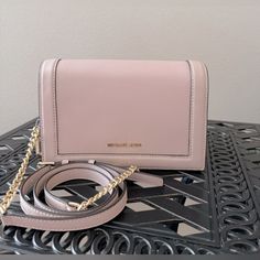 Nwot Michael Kors Crossbody Bag Leather Color Is Soft Pink Gold Tone Hardwrae Detachable Strap Adjustable Strap 8.5 X 5 X 3 Inches Add This To Your Collection! Happy Poshing! Michael Kors Crossbody Bag, Michael Kors Crossbody, Pink Gold, Leather Crossbody Bag, Soft Pink, Pink And Gold, Crossbody Bag, Adjustable Straps, Gold Tones