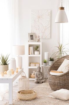 a white living room with wicker furniture and plants on the shelves in front of it