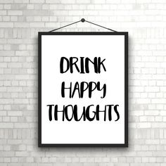 a black and white poster with the words drink happy thoughts hanging on a brick wall