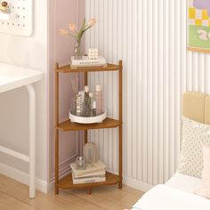 a corner shelf in the corner of a bedroom with flowers and personal care products on it