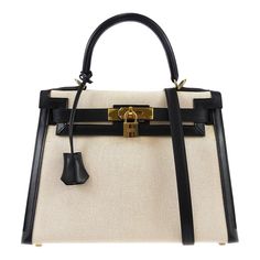 Hermes * Kelly 28 Sellier 2way Shoulder Handbag Beige Black Toile H Box Calf    Engraved / Number :  14C □ F ;Production in 2002    Pocket :  Outside: -, Inside: Zipper Pocket*1, Pocket*2    Size(Inch) :  W 11.4 x H 8.7 x D 4.7 " Handle Drop. 3.5 ", Strap Drop. 17.7 "    Size(cm) :  W 29.0 x H 22.0 x D 12.0 cm Handle Drop. 9.0 cm, Strap Drop. 45.0 cm    Color / Material :  Beige, Black / Toile H, Box Calf    Comes with :  Shoulder Strap, Padlock, Key x2, Key cover, Dust Bag, Dust Bag for Shoulde Designer Canvas Bag With Top Handle For Errands, Classic Handheld Satchel With Dust Bag, Elegant Shoulder Bag With Detachable Handle In Natural Color, Elegant Natural Shoulder Bag With Detachable Handle, Classic Tan Bags With Dust Bag, Classic Tan Bags With Dust Bag Included, Luxury Satchel Canvas Bag For Daily Use, Designer Canvas Bag With Top Handle For Daily Use, Designer Beige Top Handle Canvas Bag