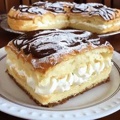 two desserts on plates sitting on a table