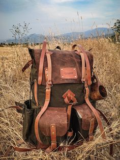 Materials ▪️ 100% cotton, water resistant waxed canvas and Genuine Leather ▫️Wide and deep flasks on the right and left ▪️550 Lb parachute rope as tension straps on the flask ▫️Leather hanger for hanging knives and axes on both sides ▪️Two front pockets ▫️Axe hanger with buckle between front pockets ▪️ Foam padded shoulder straps and back ▫️Hip Belt: By giving some of the weight from the shoulders to the hip bone, it prevents the shoulders from getting sore in a short time and provides a more co Utility Waxed Canvas Bags For Outdoor, Outdoor Utility Bag In Waxed Canvas, Rugged Waxed Canvas Bag For Outdoor Activities, Leather Backpack For Hiking With Waxed Finish, Waxed Leather Backpack For Hiking, Waxed Finish Leather Backpack For Hiking, Brown Waxed Canvas Bag For Camping, Practical Waxed Canvas Backpack For Outdoor, Practical Outdoor Waxed Canvas Backpack