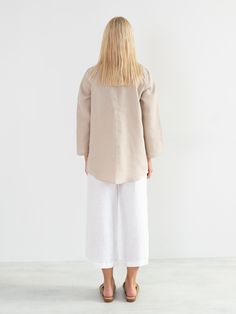 "LARA is a tunic style linen pullover shirt with long sleeves. DETAILS - Tunic style design - Long Sleeves - Collared - 100% midweight European linen fabric - Cut and sewn to order just for you in our studio COLOR - Beige, you can also choose other colors above - Fabric samples are available here https://www.etsy.com/listing/586569696/linen-fabric-samples SIZING & FIT - Length (shoulder to hem) is approximately 28 inches / 71 cm - Bust (pit to pit) is approximately 19 inches / 48 cm - Waist Linen Blouse With Pockets And Shirttail Hem, Long Sleeve Linen Tops For Daywear, Casual Long Sleeve Flax Blouse, Relaxed Fit Long Sleeve Blouse In Flax Color, Flax Long Sleeve Relaxed Fit Blouse, Flax Colored Long Sleeve Relaxed Fit Blouse, Flax Blouse For Spring Workwear, Spring Workwear Blouse In Flax Color, Spring Relaxed Fit Tunic With Pockets