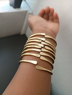 This are adjustable unisex bracelets measuring approximate 3  inches diameter which is bendable to fit small and large wrists. Adjustable Gold Band Cuff Bracelet, Brass Bangle Bracelet, Trendy Adjustable Brass Bracelets, Trendy Handmade Gold Cuff Bracelet, Gold Handmade Trendy Cuff Bracelet, Adjustable Bronze Metal Bracelets, Gold Metal Jewelry With Adjustable Band, Trendy Gold Band Jewelry, Gold Adjustable Bangle Bracelet