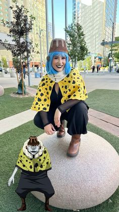 a woman and her dog dressed up in costumes