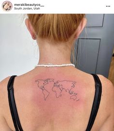 a woman with a world map tattoo on her back