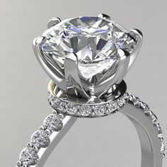 a close up view of a diamond engagement ring