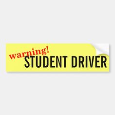 a yellow bumper sticker with the words warning student driver written in red on it