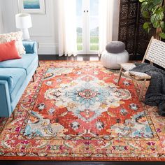 a living room filled with furniture and a large rug