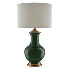 a green lamp with a white shade on it