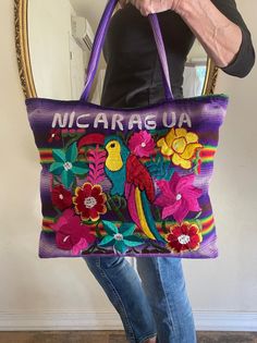 "Large embroidered tote, purse, shoulder bag, Embroidered flowers, Colorful Bird Lined with Zip closure Great condition. Says Nicaragua on it. 14\" tall 16\" width 3 1/2\" thick 9 1/2\" strap drop Excellent condition NK189DR Large embroidered tote, purse, shoulder bag, Embroidered flowers, Colorful Bird" Multicolor Floral Embroidered Tote Shoulder Bag, Multicolor Floral Embroidery Tote Shoulder Bag, Multicolor Bags With Embroidered Logo For Everyday Use, Multicolor Floral Embroidered Tote Bag, Multicolor Floral Embroidered Shoulder Bag For Travel, Multicolor Floral Embroidery Shoulder Bag For Travel, Embroidered Multicolor Travel Bag, Multicolor Embroidered Tote Bag, Multicolor Embroidered Travel Bag