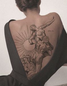 a woman with a tattoo on her back