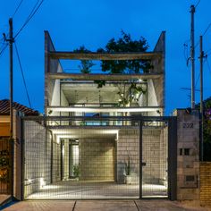 an entrance to a modern house at night