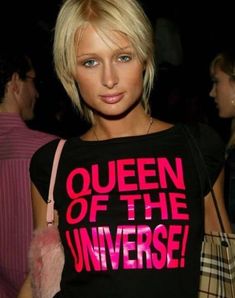 a woman with blonde hair wearing a t - shirt that says queen of the universe