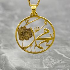 Crafted with exquisite detail and reverence, the Muhammad Written Necklace transcends mere jewelry to embody a sacred symbol of faith. Made of lustrous 925 sterling silver and elegantly plated with 18K gold, this Arabic pendant exudes timeless elegance. For Muslim women seeking a meaningful accessory, this necklace serves as a heartfelt gesture or a personal keepsake. Perfect for everyday wear or special occasions, it seamlessly merges spirituality with style. Embrace the beauty and significance Yellow Gold Round Jewelry For Blessing, Engraved Yellow Gold Jewelry For Blessing, Symbolic Engraved Jewelry For Blessing, Gold Round Jewelry For Blessing, Symbolic Necklace With Polished Finish For Gift, Symbolic Gold Jewelry For Blessing, Gold Spiritual Jewelry For Anniversary, Yellow Gold Medallion Jewelry For Blessing, Spiritual Necklace With Intricate Design For Anniversary