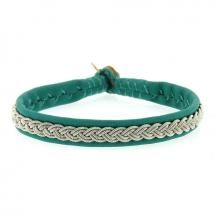 a green leather bracelet with silver beads