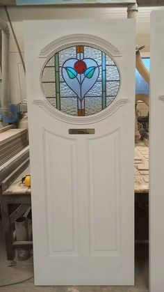 two white doors with stained glass on them