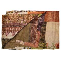 an old blanket with many different colors and patterns