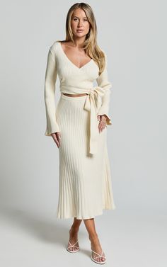 Andreia Midi Dress - Knitted Wrap Long Sleeve Dress in Cream | Showpo USA Beige Knit V-neck Midi Dress, Cream Color Outfits For Women, Chic Cream Sweater Dress For Spring, Chic Beige Midi Length Sweater Dress, Chic Cream Sweater Dress, Chic Beige Ribbed Sweater Dress, Chic Cream Dress For Loungewear, Chic Cream Knit Dresses, Elegant Neutral Sweater Dress For Fall