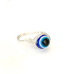 Evil Eye Ring / Blue Evil Eye / Silver/ Lucky Ring Adjustable Sterling Silver Evil Eye Ring, Adjustable Symbolic Blue Rings, Blue Spiritual Ring With Evil Eye, Adjustable Sterling Silver Eye-shaped Jewelry, Spiritual Blue Ring With Evil Eye Detail, Symbolic Adjustable Blue Rings, Spiritual Blue Rings With Evil Eye Detail, Spiritual Blue Evil Eye Ring, Adjustable Evil Eye Ring Jewelry