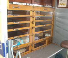 the inside of a storage room with lots of drawers