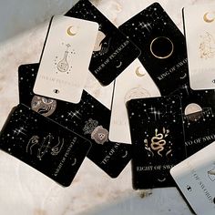 several cards with zodiac signs on them sitting next to each other