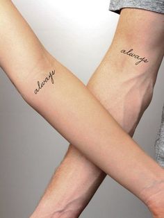 two people holding hands with tattoos on their arms that say, always and always in cursive writing