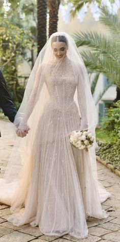 the bride and groom are walking together