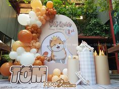 an image of a birthday decoration with balloons and animals on the front yard at a children's birthday party