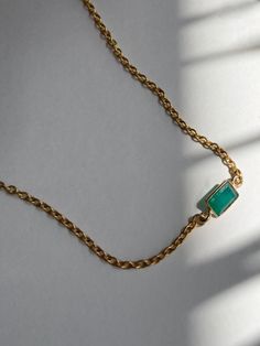 petite necklace with a mini rectangular green onyx stone charm. 
 ~ Encased green onyx stone ~ 18k gold-plated ringlet brass chain ~ 14-16" adjustable length ~ Lobster hook closure 
 ~ Each piece of jewelry comes in a velvet pouch in our signature box, perfect for gifting. Green Emerald Necklace With Adjustable Chain, Gift Yellow Gold Emerald Necklace With Adjustable Chain, Dainty Emerald Necklace With Delicate Chain For Everyday, Dainty Emerald Necklace With Adjustable Chain As Gift, Minimalist Green Emerald Necklace For Everyday, Dainty Emerald Jewelry With Adjustable Chain, Minimalist Green Emerald Necklace With Delicate Chain, Dainty Gold Emerald Necklace With Adjustable Chain, Minimalist Gold Emerald Necklace With Delicate Chain