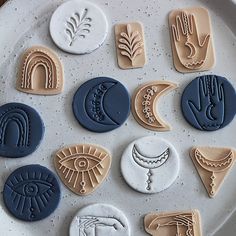 nine cookies decorated with different designs on a plate