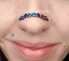 Hematite Oil Slick Double Nostril Nose Bridge (Stainless Steel) Made to Order!  Please use the reference picture in the ad to make accurate measurements of your nose (hole-to-hole) and message me your MM (millimeters) as soon as you order! This Nose Chain is made with stainless steel. Which means no tarnish on your nose! I appreciate your business and allowing me to make you a custom creation.  <3 Holly Please Note: Due to variations in sizing, some nose chains will have more or less beads to accurately meet your measurements. (You will not be charged more/less for either.) Most display pics are made to a 38 to 40mm measurement display size. Bead color will vary in coloration depending on the cut. (Designs do NOT include STUDS. I recommend "push pin" internally threaded or any internally t Nose Piercing Ideas, Double Nostril, Nose Chain, Double Nose Piercing, More And Less, Oil Slick, Nose Rings, Nose Ring Stud, Nose Stud