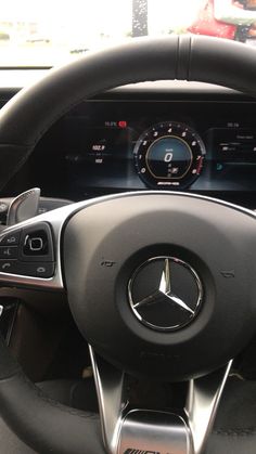 the steering wheel and dashboard of a mercedes benz - benz car with an electronic display