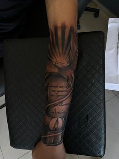 a person with a tattoo on their arm