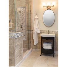 a bathroom with a sink, mirror and shower in it's center area is shown