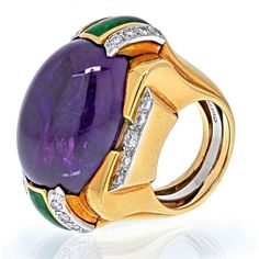 Indulge in the mesmerizing allure of this David Webb Platinum & 18K Yellow Gold Oval Amethyst, Green Enamel And Diamond Ring. Designed by the renowned David Webb, this exquisite piece showcases his signature use of bold colors and captivating craftsmanship.At the heart of the ring rests a stunning oval cabochon amethyst, radiating a captivating purple hue that enchants the senses. Surrounding the amethyst are round brilliant-cut diamonds, their shimmering facets adding a touch of glamorous spark Haute Jewelry, Alexis Bittar Jewelry, Genie Bottle, David Webb, Yellow Rings, Yellow Jewelry, Alexis Bittar, Green Enamel, Gem Stone