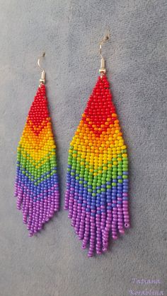 "These handmade author's earrings\" Rainbow flag LGBT \" are made of high-quality Czech beads and strong synthetic thread.In these unique earrings I use my author's scheme Rainbow flag LGBT . Color: red, orange, yellow, green, blue, purple. I will make these earrings for you in your color. Copy without my permission is prohibited 100% hand made with love! Measurements: Length with hook -10 cm( 3.93 inch ),Width -3 cm (1.18 inch) Materials: Silver plated ear hooks Czech glass beads Tytan Thread" Tie Dye Beaded Earrings, Rainbow Dangle Earrings With Tiny Beads, Handmade Jewelry For Pride Gift, Beaded Rainbow Drop Earrings, Rainbow Beaded Drop Earrings, Adjustable Rainbow Earrings With Tiny Beads, Rainbow Tiny Beads Drop Earrings, Rainbow Colorful Bead Drop Earrings, Rainbow Colorful Beads Drop Earrings