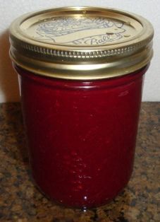 a red jar sitting on top of a counter