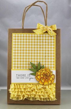 there is no one like you yellow gingham gift bag with flowers on it