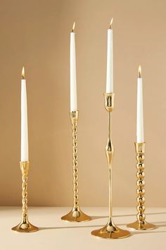 three candles are lined up next to each other