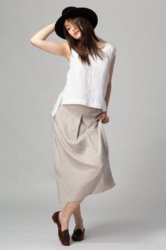 READY TO SHIP - Basic linen skirt, with a chic front box pleat that drapes beautifully down to a midi length. The subtle A-line silhouette creates a soft, relaxed and feminine look that is easily complimented by any top shape, fitted, relaxed or boxy. The concealed side pockets make it easy to wear with platforms, flat sandals and trainers. Made of quality stonewashed European linen, softened and wrinkled to perfection. FIT The Front Pleat Skirt has a relaxed fit and sits slightly below the wais Skirt Linen, Box Pleat Skirt, Pleat Skirt, Style Finder, Linen Style, European Linens, Skirt With Pockets, French Seam, Linen Skirt